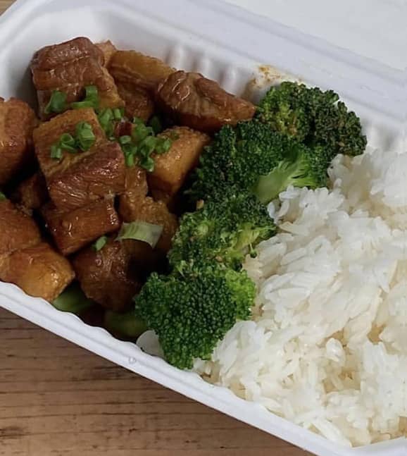 A photo of a delicious HuNan Chinese dish of Pork Belly with broccoli and rice