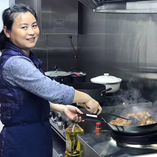 A photo of Sami in her food truck cooking